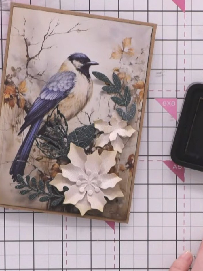 Step 5: Using a blending brush, apply brushed corduroy distress ink to the edges of the white paper petals. Blend the 