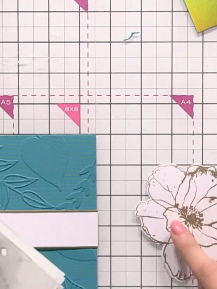 Step 12: Use a layering stencil and blending brush with teal ink to add colour to the centre of the flower, leaving the