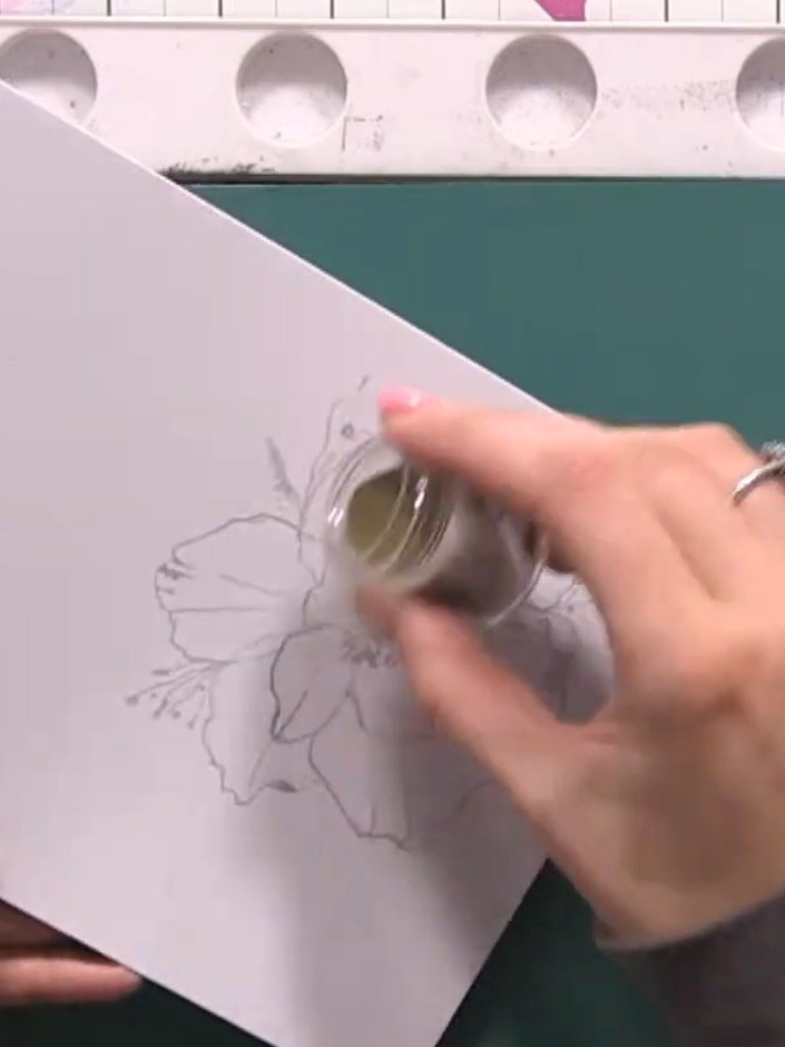 Step 9: Immediately pour gold embossing powder onto the wet stamped image, covering all the inked areas completely. Ta