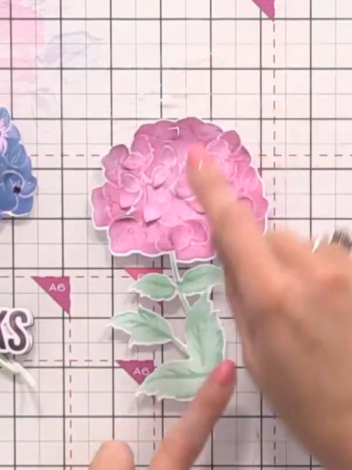 Step 9: Add your pre-made sentiment piece with the word 'THANKS' to the left side of the card, positioning it so the l