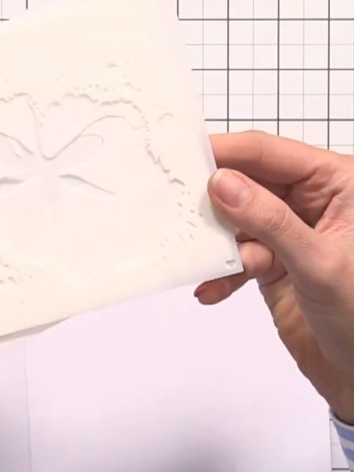 Step 1: Gather your white card blank and the five stencils from the Dreamy Blooms set. Arrange the stencils in order r