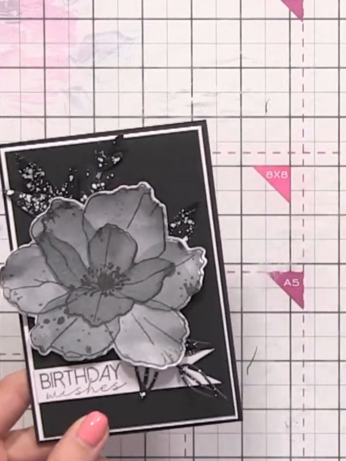Step 12: Attach the sentiment banner flat across the lower portion of the card front, positioning it to complement the 