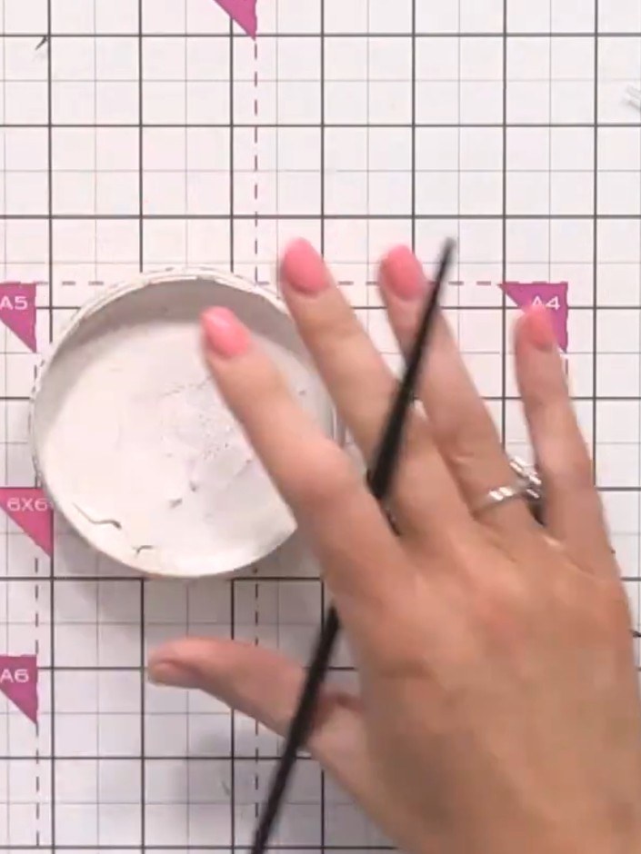 Step 8: Apply white ink or paint to the black skeleton leaves and foliage pieces using a sponge or ink pad. This will 