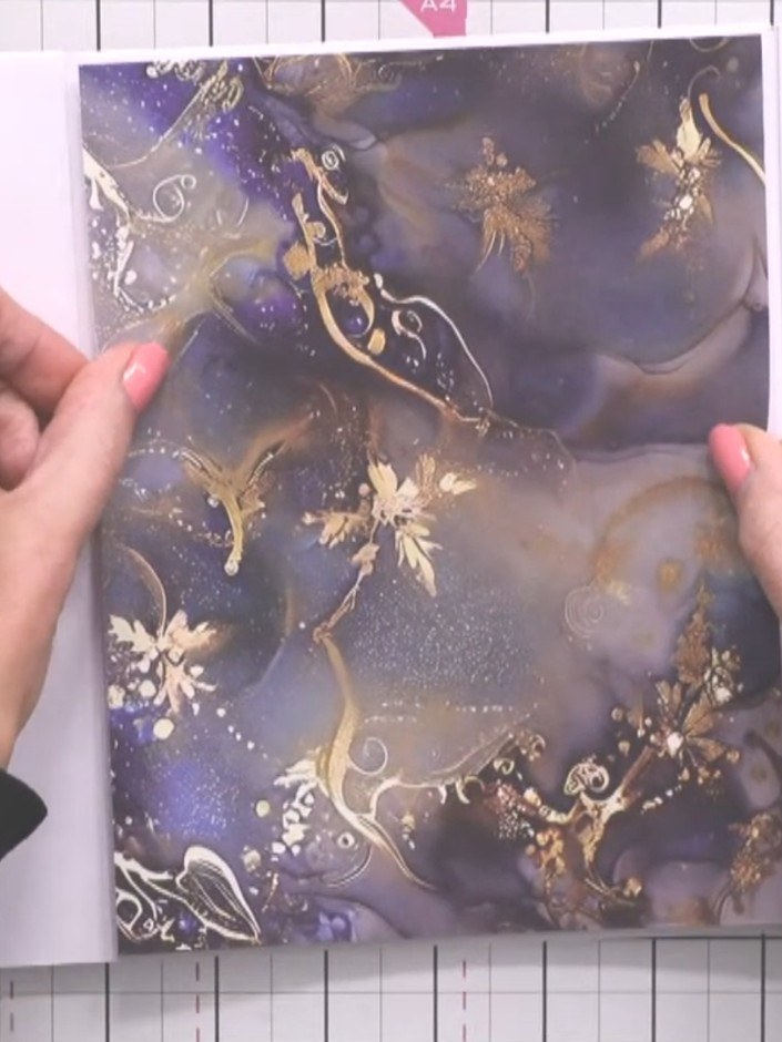 Step 11: Wrap the belly band around the closed album to hold it together.