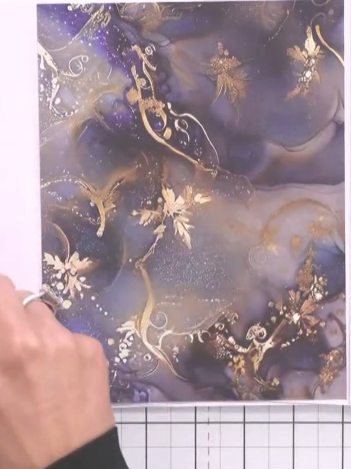 Step 12: Glue a decorative topper onto the belly band to finish the album. Position the topper centrally to cover the g