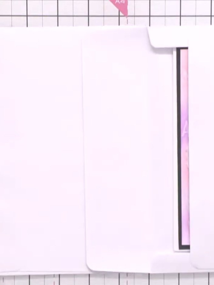 Step 3: Take another white card blank and fold it to create an additional pocket page. The folded card creates an inst