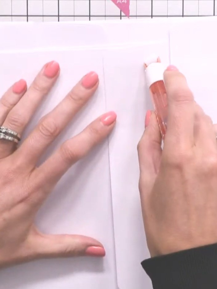 Step 6: Cut decorative paper to cover the spine and centre of your album to hide the tape joins. Use the decorative pa