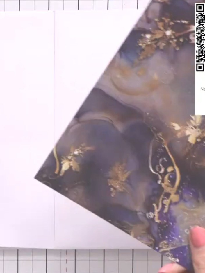 Step 9: Secure your decorative topper or embellishment to the front cover of the album using tape pens or adhesive.