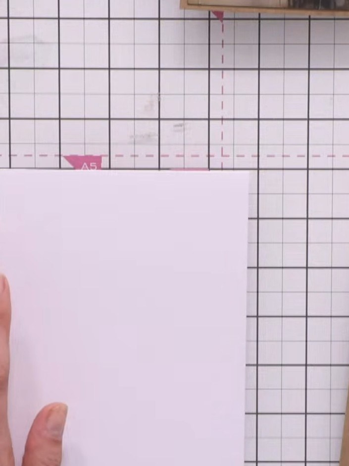 Step 1: Start with a white A5 card blank and a piece of white cardstock. Position the white cardstock to layer on top 