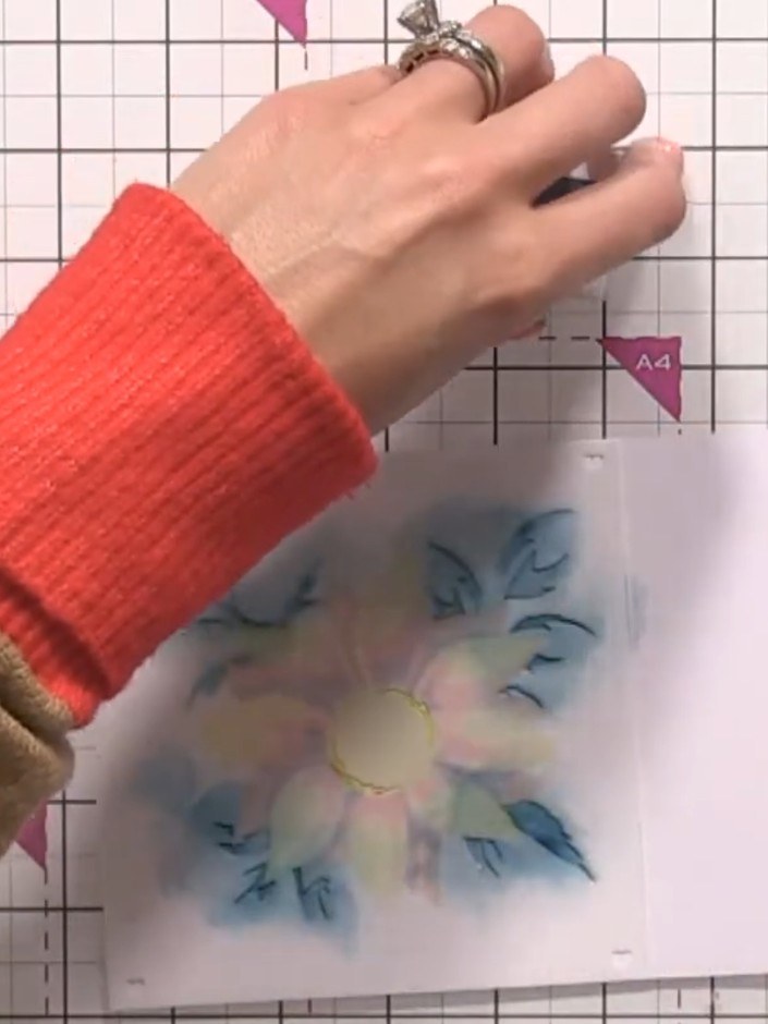 Step 5: Position stencil number two over your work, carefully lining up the registration marks. Apply ink through the 