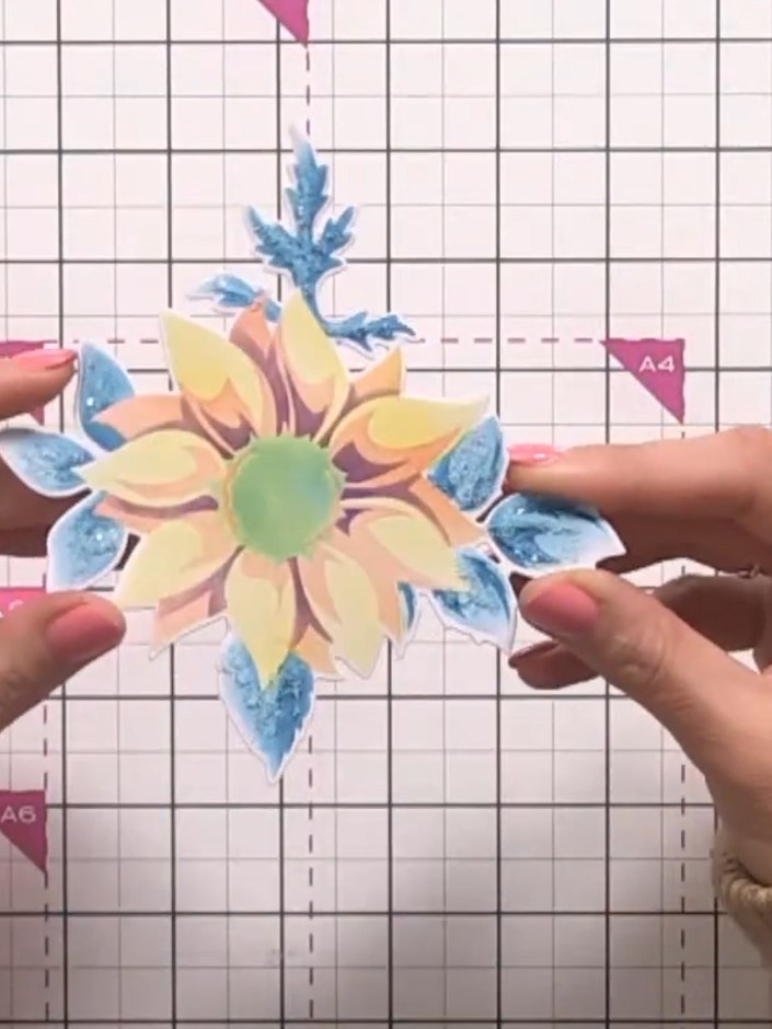 Step 6: Continue building up the sunflower design by layering stencils three, four and five. Apply ink in different co