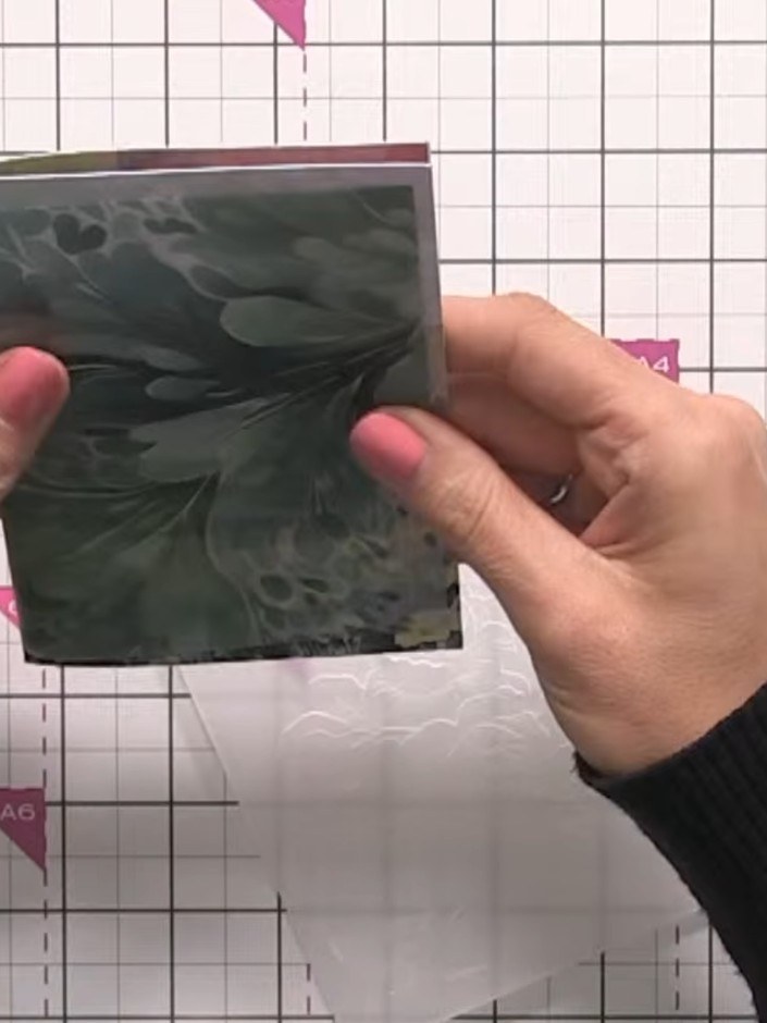 Step 5: Position your vellum piece as a wrap around the front of the card base. Allow the vellum to extend slightly ar