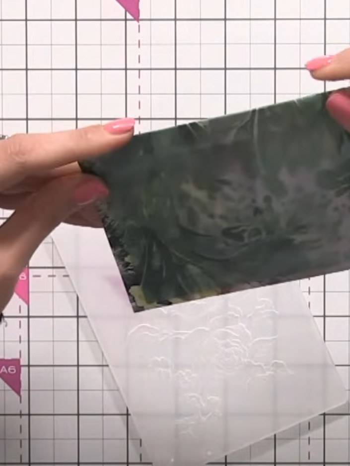 Step 6: Trim the vellum on the back of the card to approximately one inch depth. This creates an intentional wrapped l