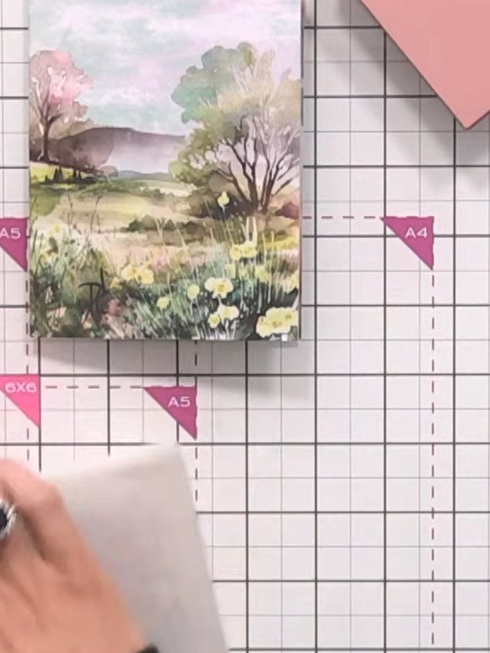 Step 8: Secure the vellum wrap to the back of the card using double-sided tape. Position the tape along the hinge area