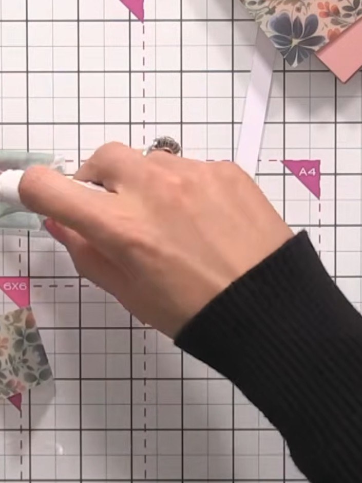 Step 6: Apply double-sided tape to the left and right edges of the vellum belly band. Position the tape along both ver