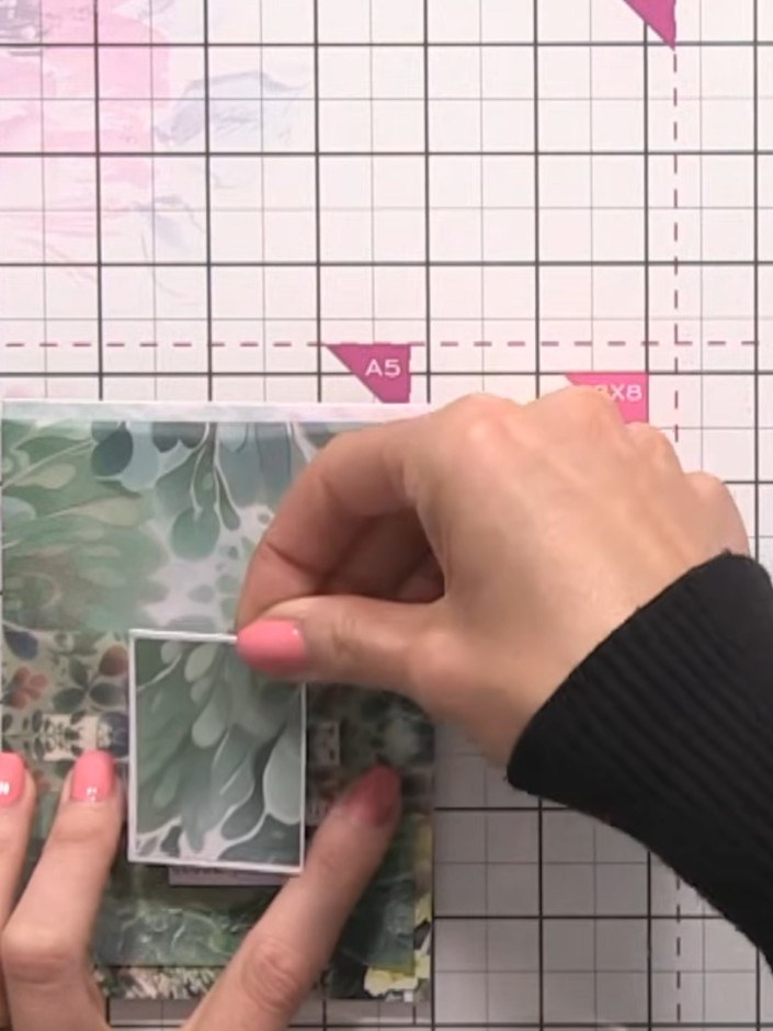 Step 8: Adhere the white card rectangle to the centre of the vellum belly band using double-sided tape. Position it ce