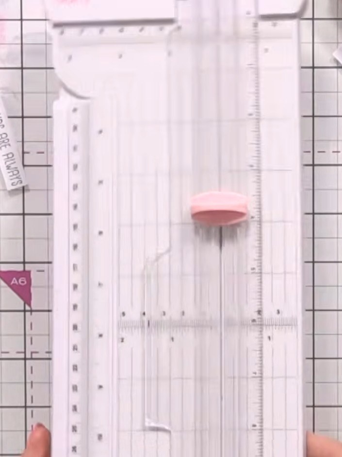 Step 6: Arrange your sentiment strips on top of the vellum overlay, positioning them at varying heights for visual int