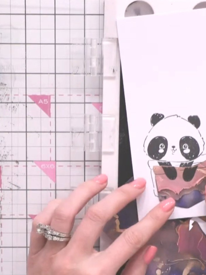 Step 3: Carefully cut out the panda character from the Pocket Pals stamp set, following the outline closely with sciss