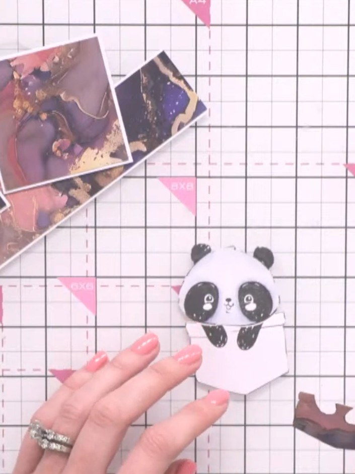 Step 8: Adhere the panda pocket detail to the centre of the patterned square using glue.