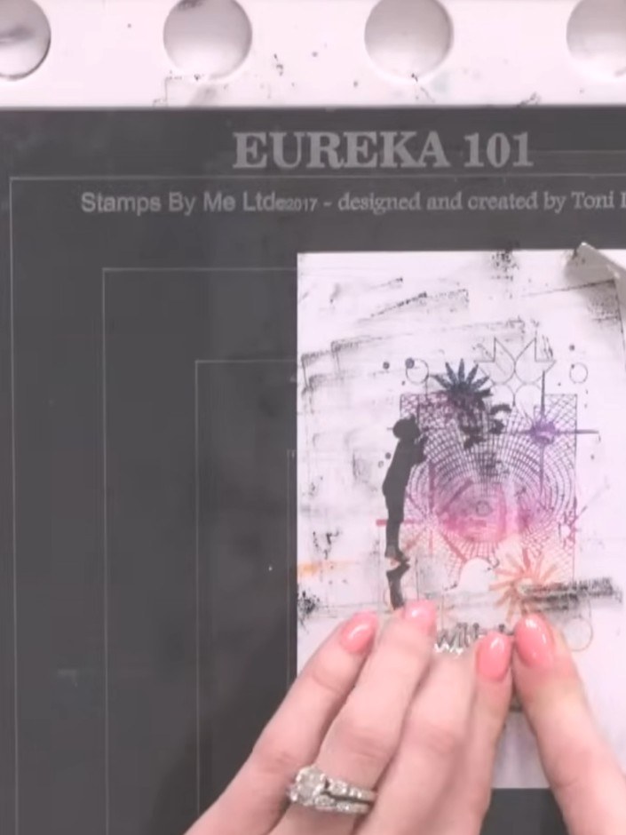 Step 11: Mount the stamped panel onto a black matted layer, positioning it centrally to create an even border around al