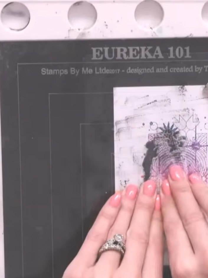 Step 9: Stamp the top portion of the design again onto the card to enhance the reflection appearance and create depth.