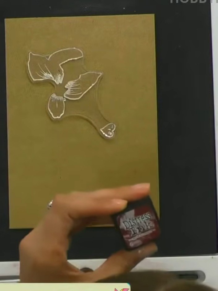 Step 2: Select your solid black lamination stamp and position it on the gold mirror card. The embossed image should sh