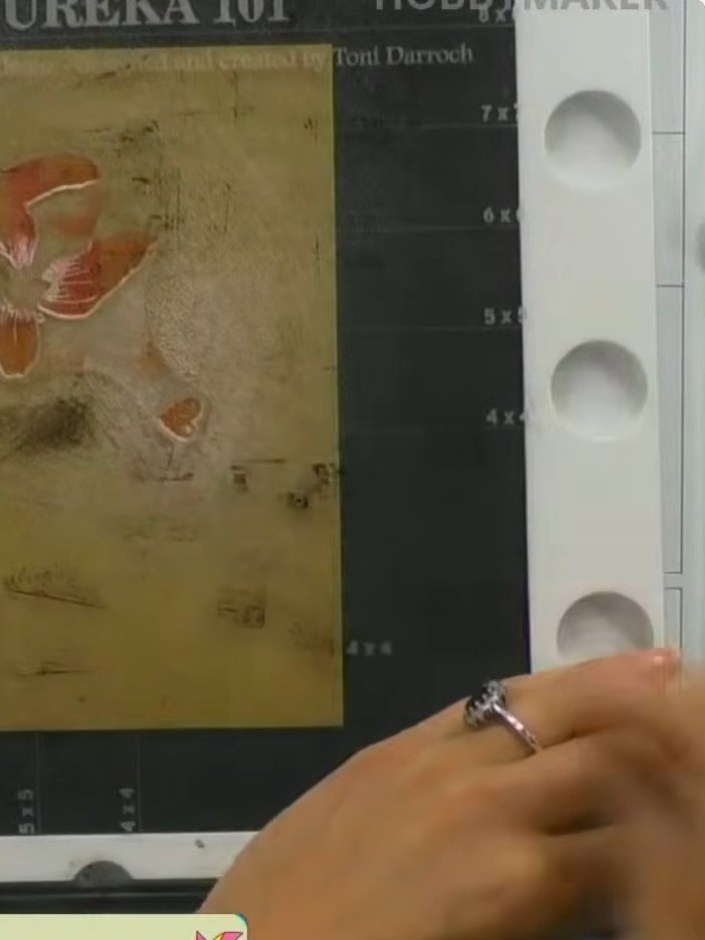 Step 4: Lightly spray the inked stamp with water to create a watercolour effect. Be careful not to over-spray, as too 