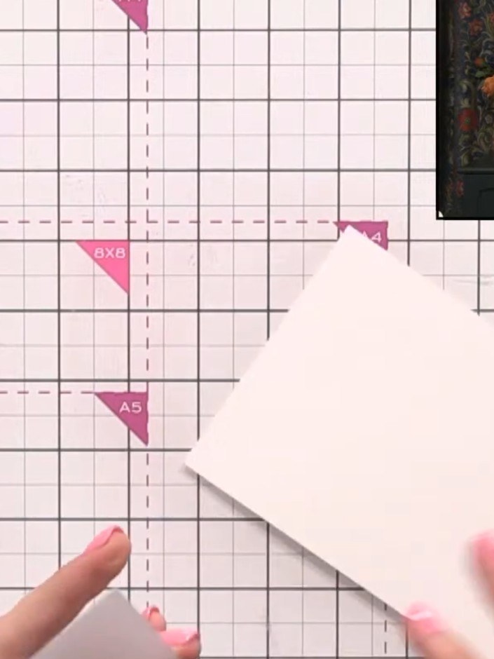 Step 1: Cut a piece of watercolour card to size and place it inside the White Rose embossing folder, ensuring the card
