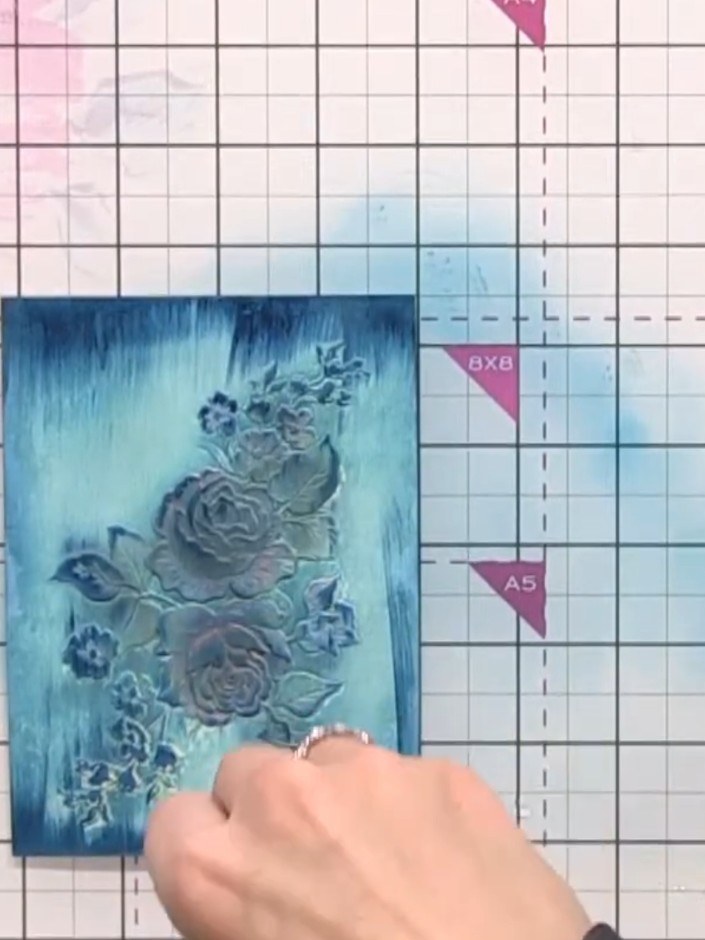 Step 12: Flick water onto the card surface to create a crackle effect. Use a piece of tissue to gently mop up the exces