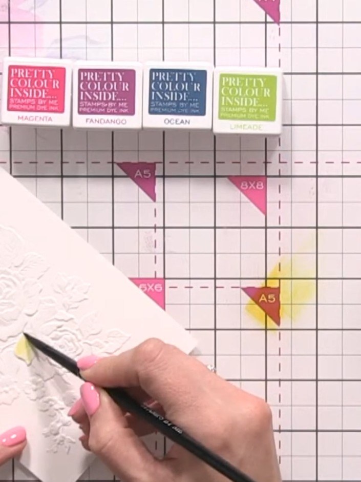 Step 4: Drop yellow watercolour onto the wet petals using a brush or pen, allowing the water to carry the colour natur
