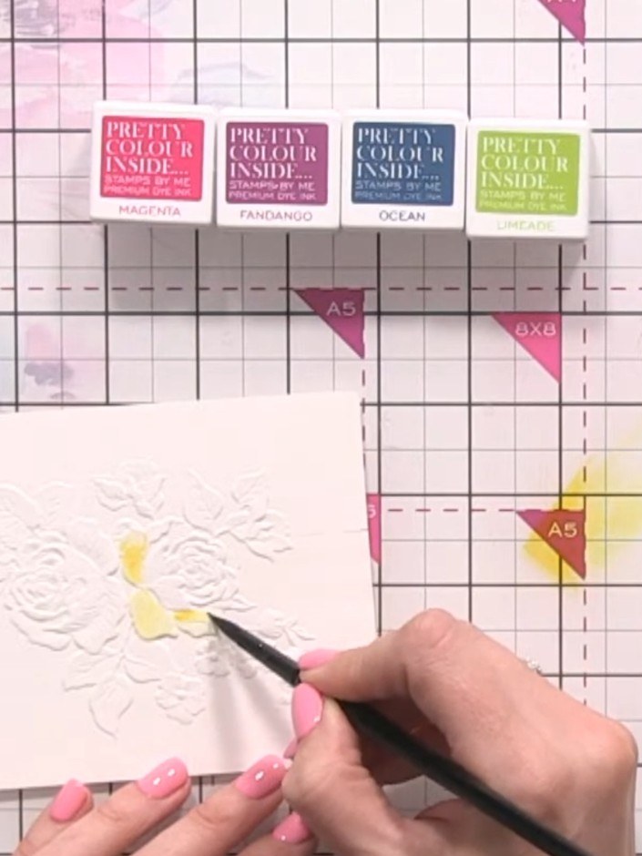 Step 5: Add pink watercolour on top of the yellow areas. Pounce the colour into the embossed lines to create depth and