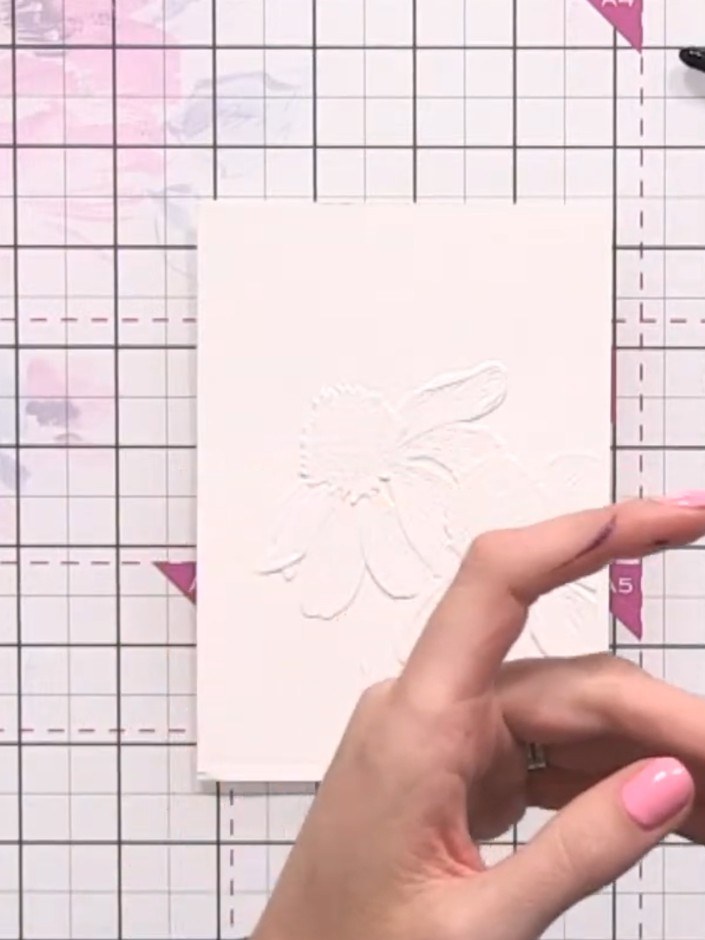 Step 3: Dilute purple or grey ink with water to create a very pale shade. Using a fine brush, drop a tiny amount of th