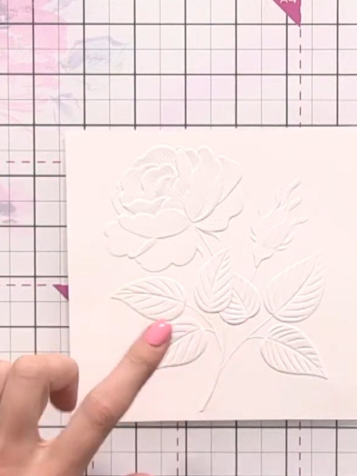 Step 1: Cut your watercolour card stock to size and run it through your die-cutting machine with the budding roses emb