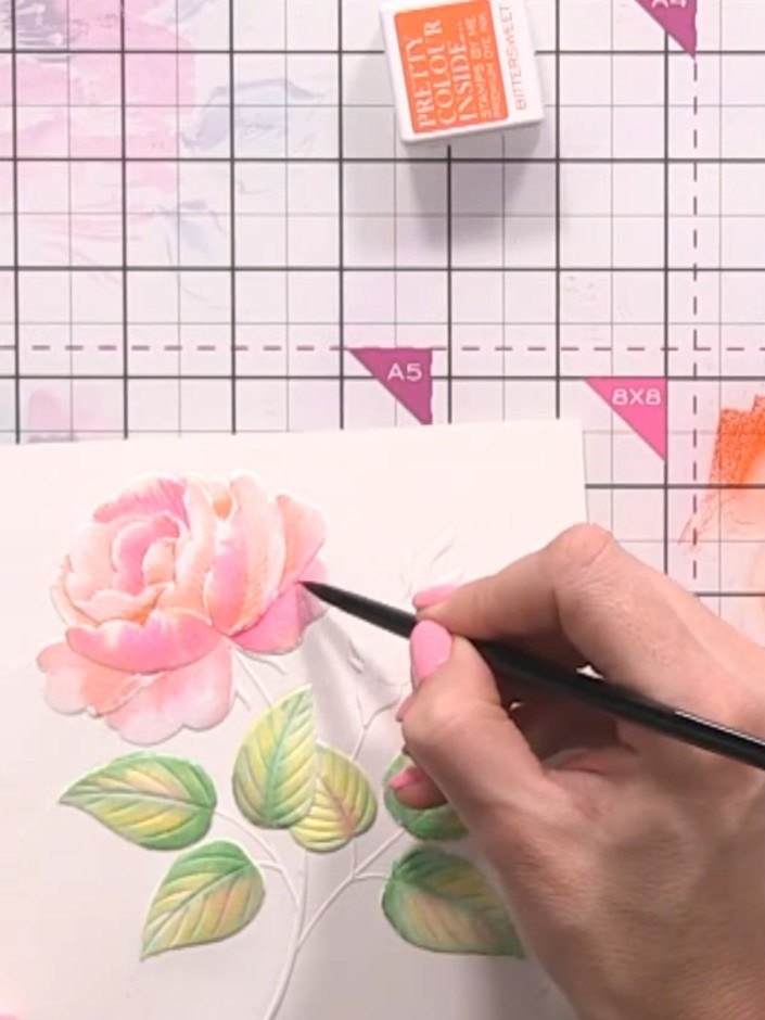 Step 10: Using a fine brush or pen, add darker pink tones to the base areas of the rose petals where shadows would natu