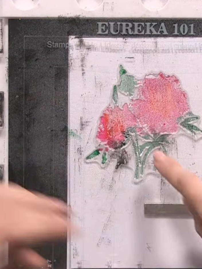 Step 5: Spray the inked stamp with water using a water spray bottle. Press the stamp down gently to ensure even covera