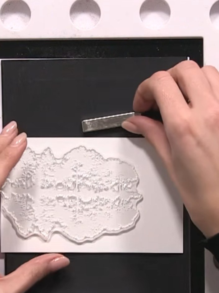 Step 1: Cut a small piece of white watercolour card and position it landscape orientation on your black card base. Use
