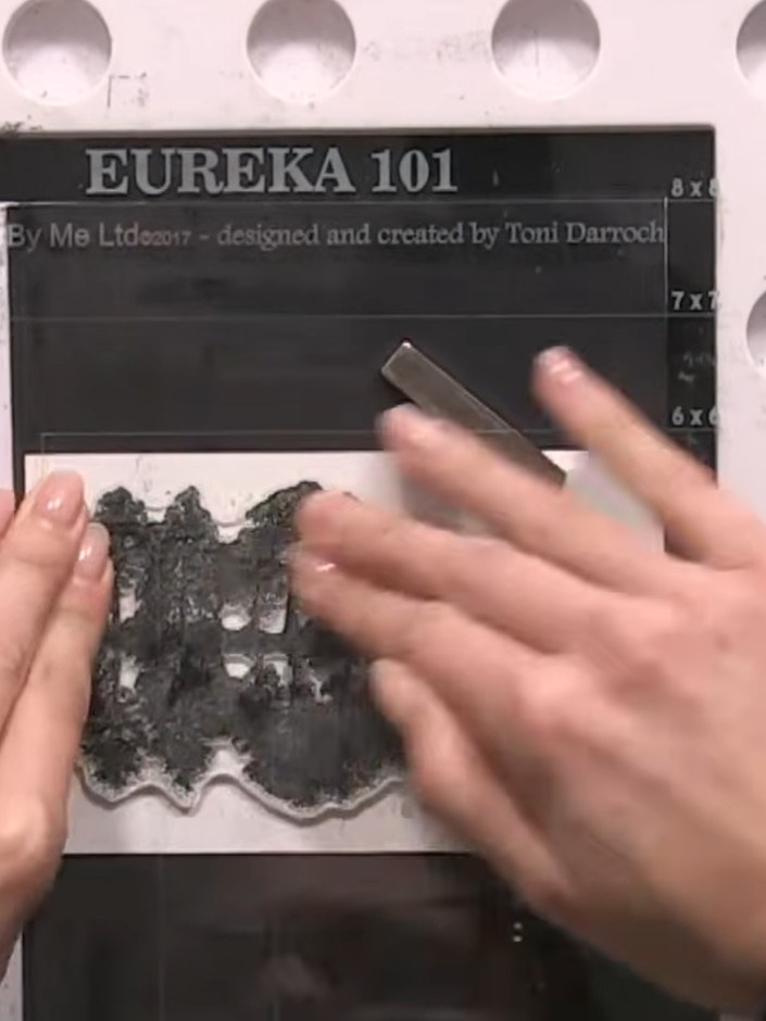 Step 2: Ink up the reflection stamp with black ink using the Eureka 101 stamping platform.