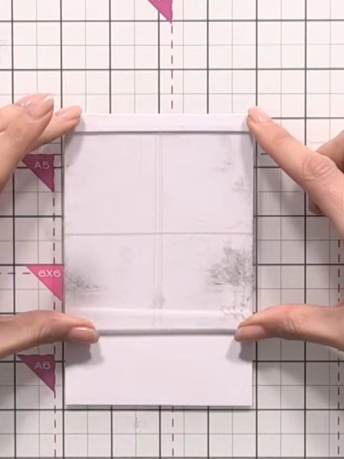 Step 10: Ink up an acrylic block with orange, pink, purple and teal inks, blending the colours together on the block su