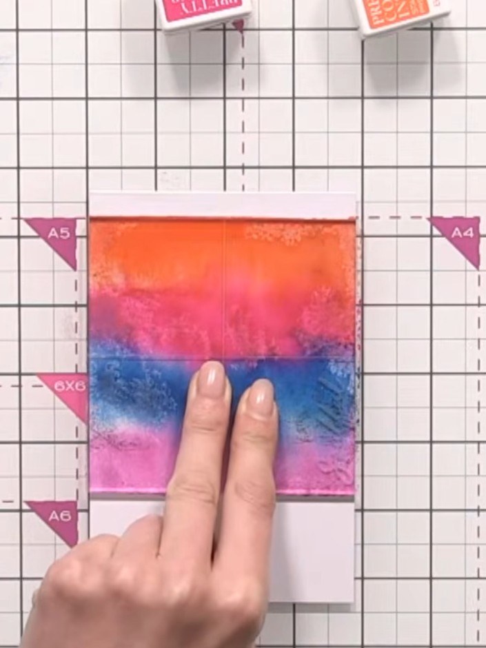 Step 12: Hold the acrylic block in place for a moment to allow the ink to transfer, then carefully lift it straight up 