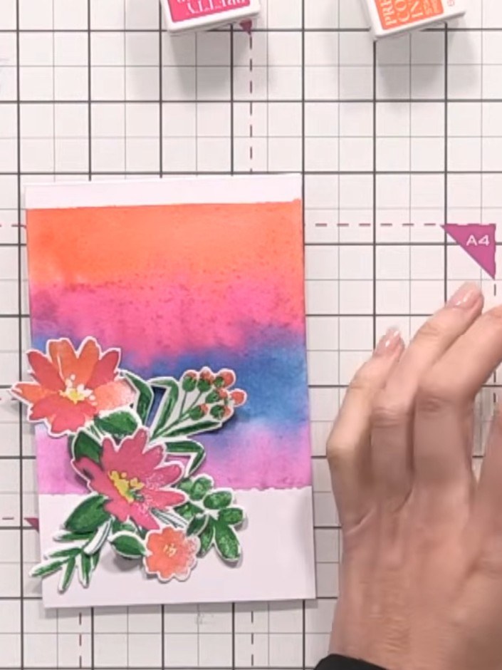 Step 14: Add your chosen sentiment to the card using adhesive foam pads to position it between or below the flower arra