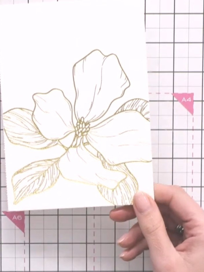 Step 1: Cut out a large flower design from the hot foiled colouring book, leaving a small border around the edge of th