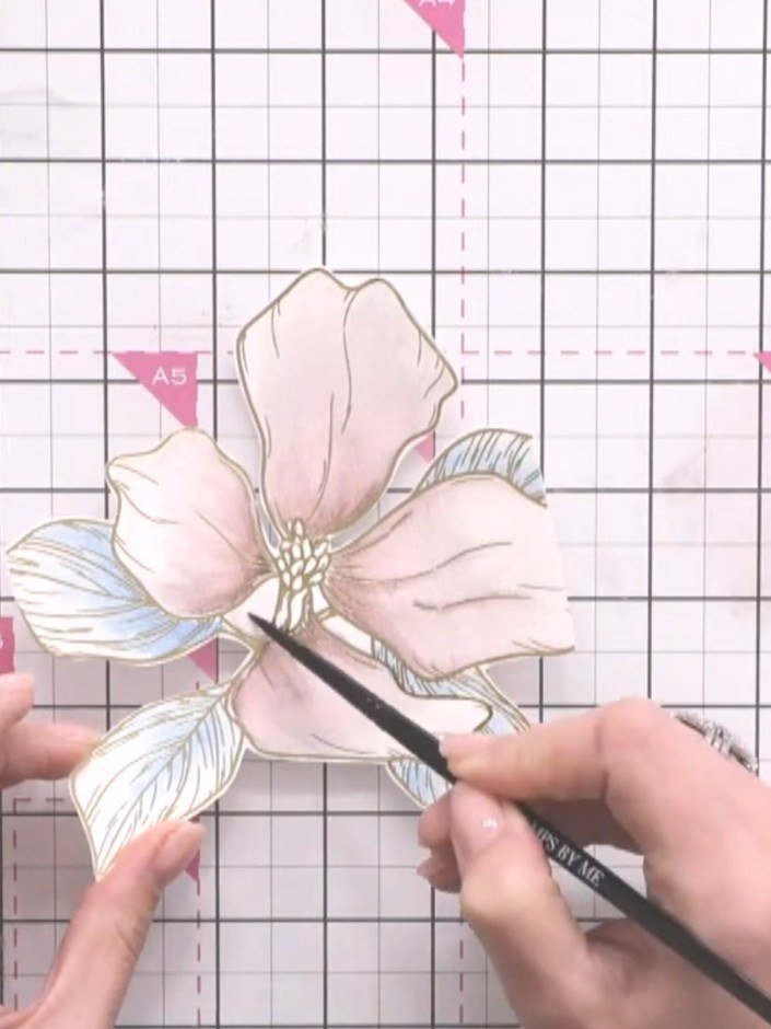 Step 8: Apply a very light wash of colour to the centre of the flower petals using a brush and water to soften any har
