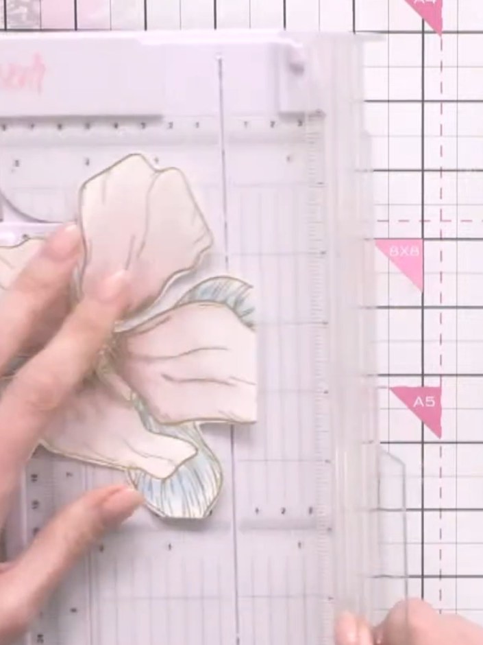 Step 9: Trim the painted flower piece to remove any harsh white lines created by cutting. Use scissors or a craft knif