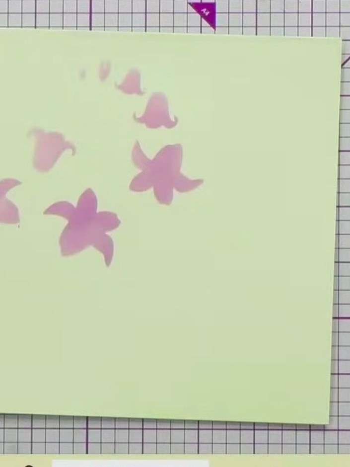 Step 2: Select stencil number one from the layering stencil set. Position it on your card base, aligning it with the e