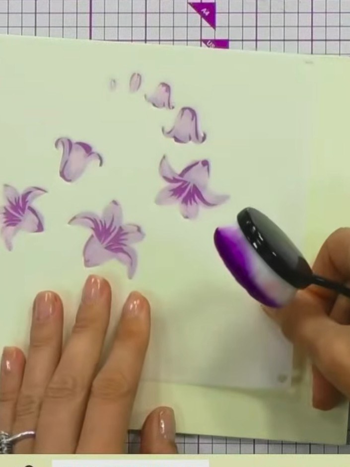 Step 5: Continue building up the bluebell design using stencils three, four and five. Gradually increase the pressure 