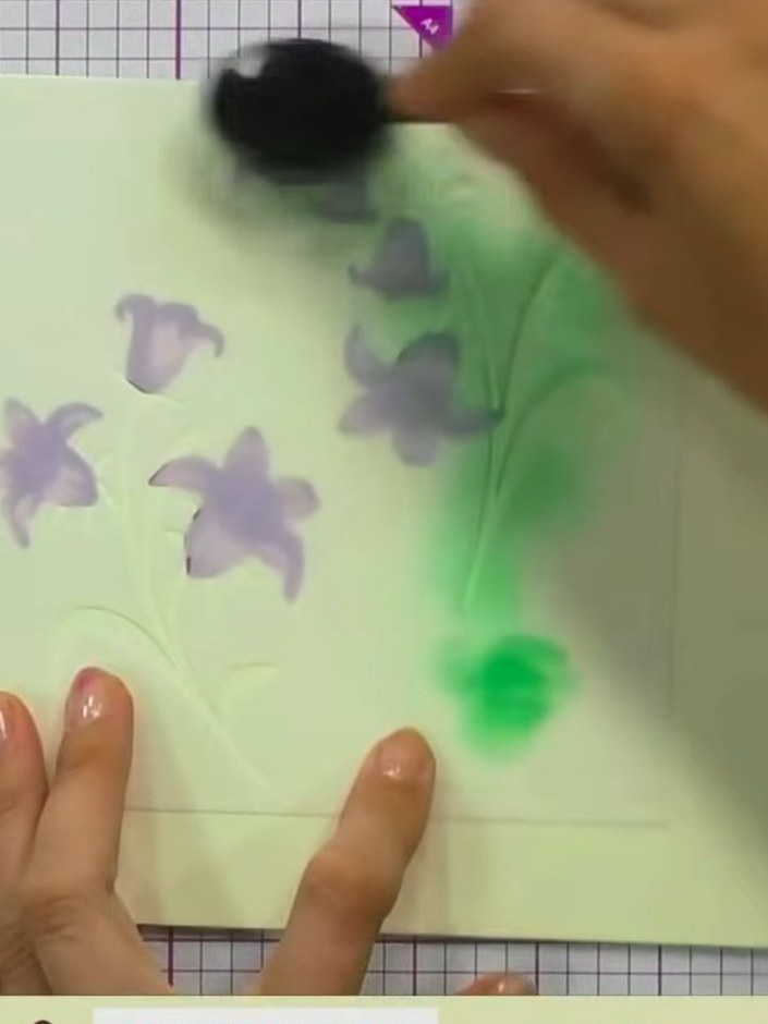 Step 7: Using lime green ink and a blending sponge, colour all the leaves and stems through the stencil. Apply the col