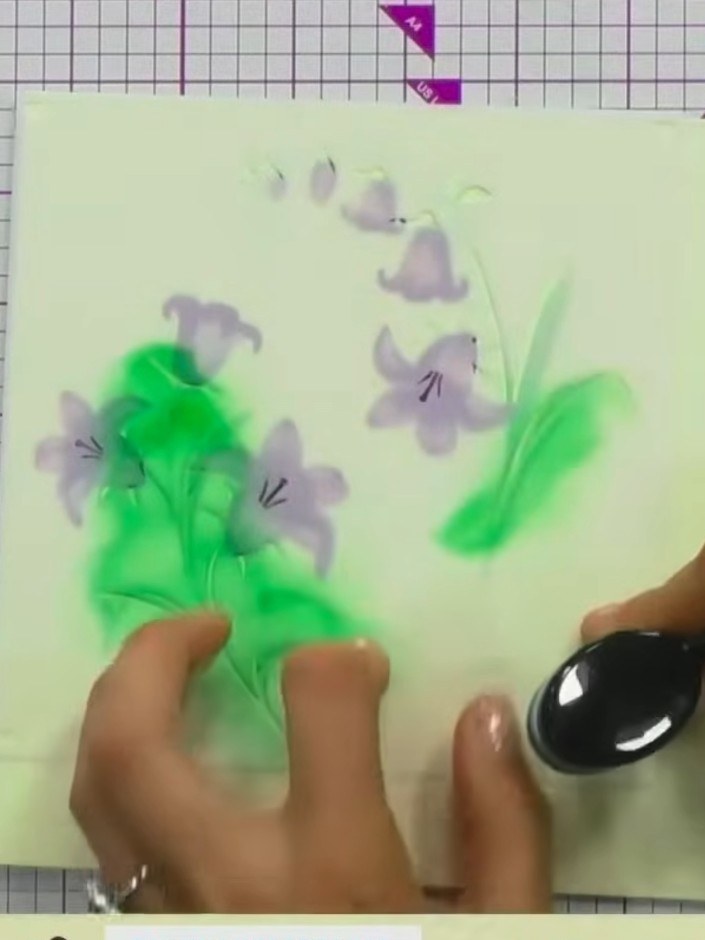 Step 9: Lightly spray the finished floral design with water using a spray bottle. This creates a soft, blended, ethere
