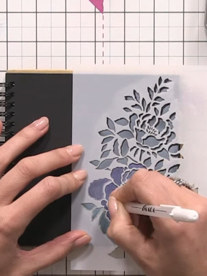 Step 8: Add decorative elements around your floral design using a white gel pen. Draw wonky lines and hash marks to an