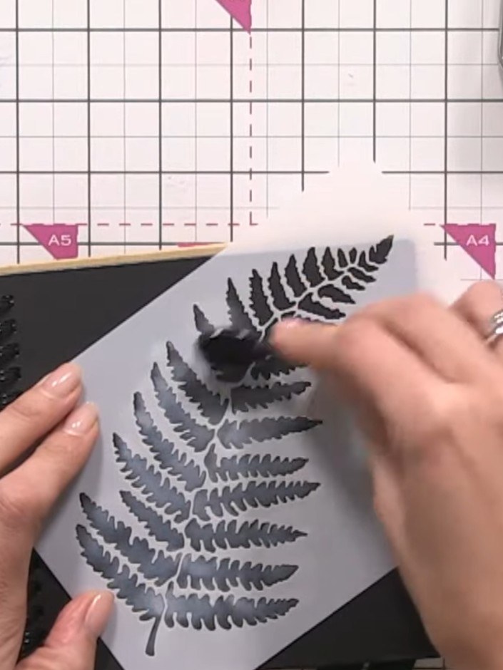 Step 2: Once the white base is dry, select a sparkly confetti ink colour such as gold. Apply the ink through the fern 