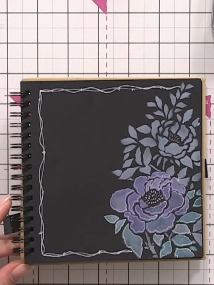 Step 8: Add decorative hash marks or doodle patterns around the floral design using a white gel pen to frame it and pr